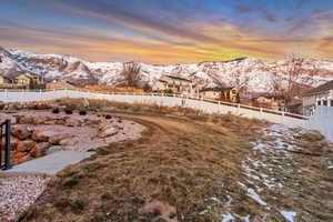 Property view of mountains from the fully landscaped and fenced yard