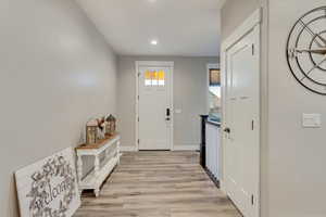 Foyer entrance featuring light wood-style flooring