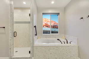 Bathroom featuring separate shower and tub