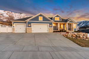 Craftsman-style home with a mountain view and a 3 car garage and RV parking