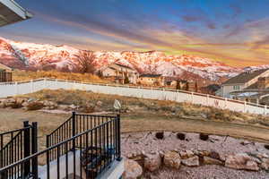 Yard at dusk with a mountain view from the back deck