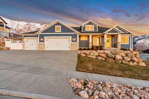 Craftsman inspired home with a garage and a mountain view