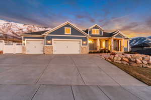 Craftsman house with a mountain view, a garage, and covered porch