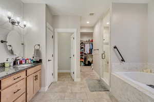 Bathroom with shower and separate bathtub