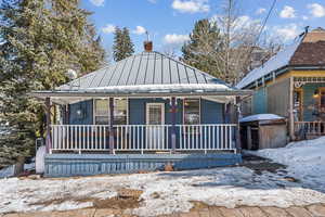 View of front of house with covered porch