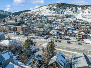 Snowy aerial view featuring a mountain view