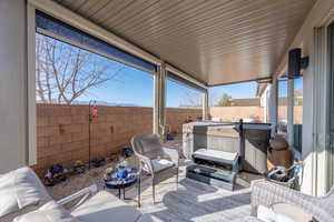 View of patio / terrace with a hot tub