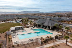 View of pool with a patio and a mountain view