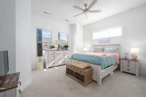 Carpeted bedroom with ceiling fan