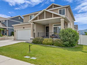 View of front of home featuring stucco siding, a porch, concrete driveway, and an attached garage