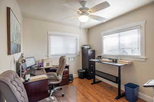 Office space featuring ceiling fan, hardwood / wood-style floors, and a textured ceiling