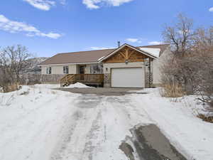 long driveway with plenty of parking for your family, guests, or toys!