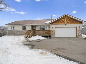 Ranch-style house featuring a garage