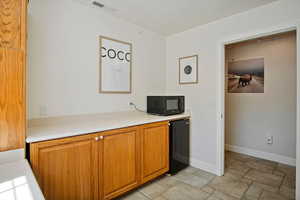 Kitchen with refrigerator