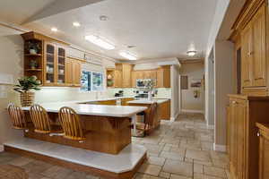 Kitchen with a kitchen breakfast bar and kitchen peninsula