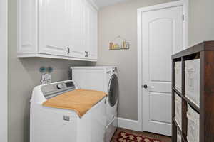 Laundry area with cabinets and washer and dryer