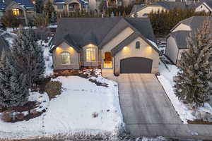 View of front facade featuring a garage