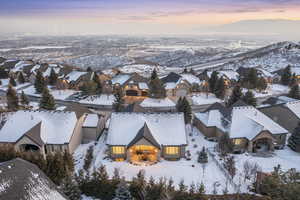 Snowy aerial view featuring a mountain view