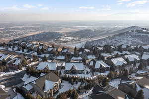 Snowy aerial view featuring a mountain view