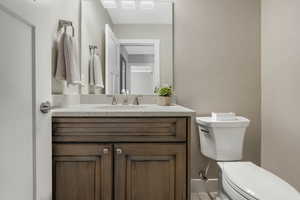 Bathroom with vanity and toilet