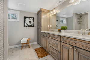 Downstairs Bathroom featuring vanity and curtained shower