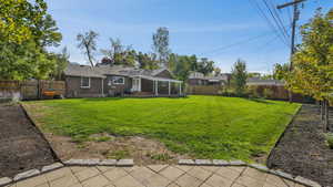 View of yard with a patio area