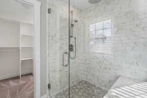 Bathroom featuring a shower with shower door