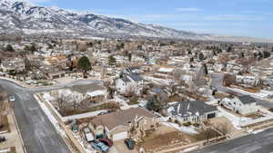 Snowy aerial view featuring a mountain view