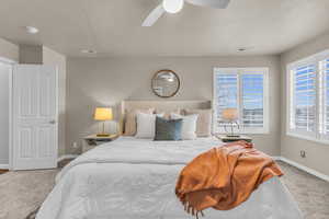 Bedroom featuring carpet floors and ceiling fan