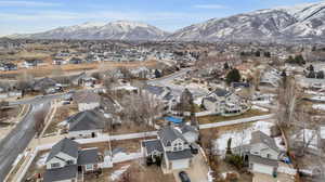 Snowy aerial view featuring a mountain view