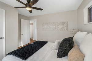 Bedroom featuring hardwood / wood-style floors and ceiling fan