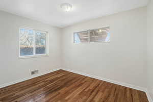 Spare room featuring hardwood / wood-style floors