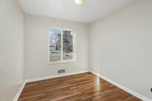 Spare room with hardwood / wood-style flooring