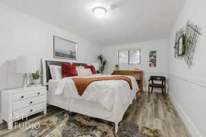 Bedroom featuring wood-type flooring