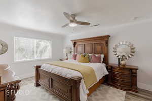 Bedroom featuring ceiling fan and light wood-type flooring