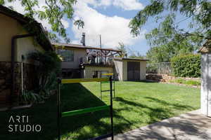 View of yard featuring a storage unit