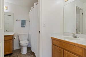 Bathroom with vanity and toilet