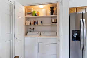 Laundry area featuring separate washer and dryer