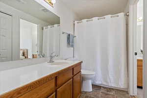 Bathroom with vanity and toilet