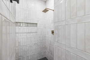 Bathroom featuring curtained shower