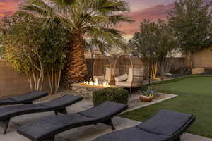 Patio terrace at dusk with a fire pit