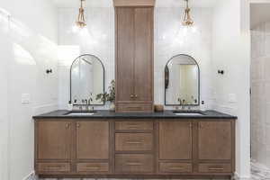 Bathroom with tile walls and vanity