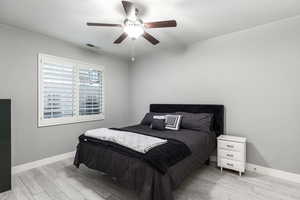 Bedroom featuring ceiling fan and light hardwood / wood-style floors