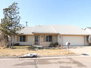 Single story home featuring a garage