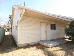 Back of house with a patio