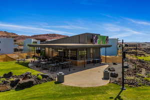 Club 73  featuring a view of the golf course, putting course, driving range