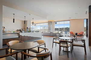 Lobby Coffee Bar with tiled dining room with a wall of windows