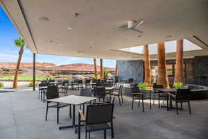 Oasis patio / terrace featuring a mountain view and ceiling fan