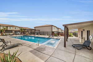 View of swimming pool with a patio area