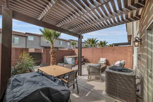 View of patio with a grill, central AC unit, and a pergola